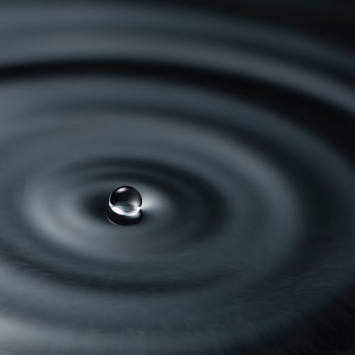 Beautiful ripples in water with a black background